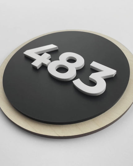 ALUMADESIGNCO round door number sign crafted from birch wood and black acrylic numbers, modern hotel room signage designed for boutique hotels, apartments, and contemporary interiors