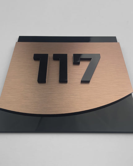 Premium bronze room number sign Flow Design by ALUMADESIGNCO featuring acrylic numbers, modern door signage for hotels, Airbnb properties, and offices
