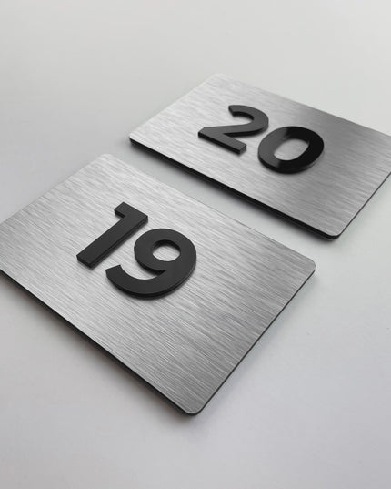 ALUMADESIGNCO silver and acrylic door number plaque with minimalist modern design, premium signage for hotels, offices, and residential buildings