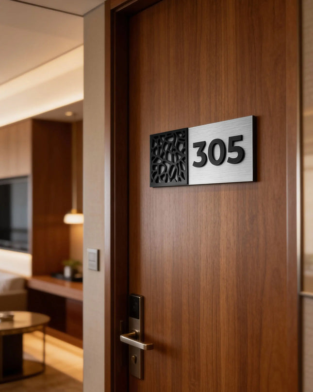 Room number plaque by ALUMADESIGNCO for identifying hotel rooms, apartment doors and office spaces with clearly displayed numerals.