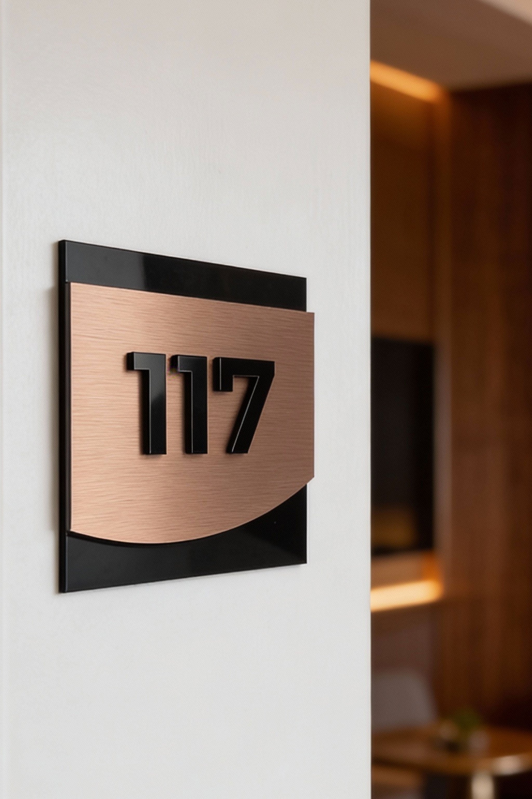 ALUMADESIGNCO premium 3D layered hotel room signage with bronze metal plaque and black acrylic numbers, modern door signage for boutique hotels, apartments, and interiors